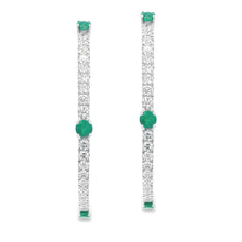 These beautiful diamond hoop earrings feature 82 round brilliant cu...