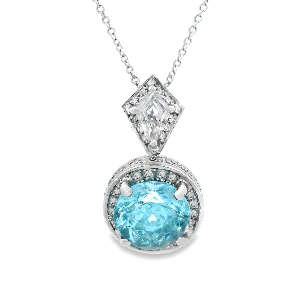 18k white gold diamond and aquamarine pendant. The diamonds total a...