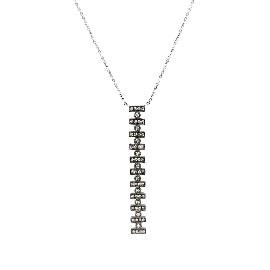 This 14k white gold Reese Brooklyn necklace features round brillian...