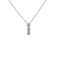 This 18k white gold bezel-set pendant features 3 round brilliant cu...