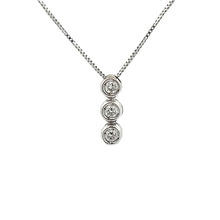 This 18k white gold bezel-set pendant features 3 round brilliant cu...