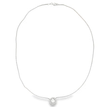 This beautiful 14k white gold pendant features a center round brill...