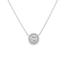 This beautiful 14k white gold pendant features a center round brill...