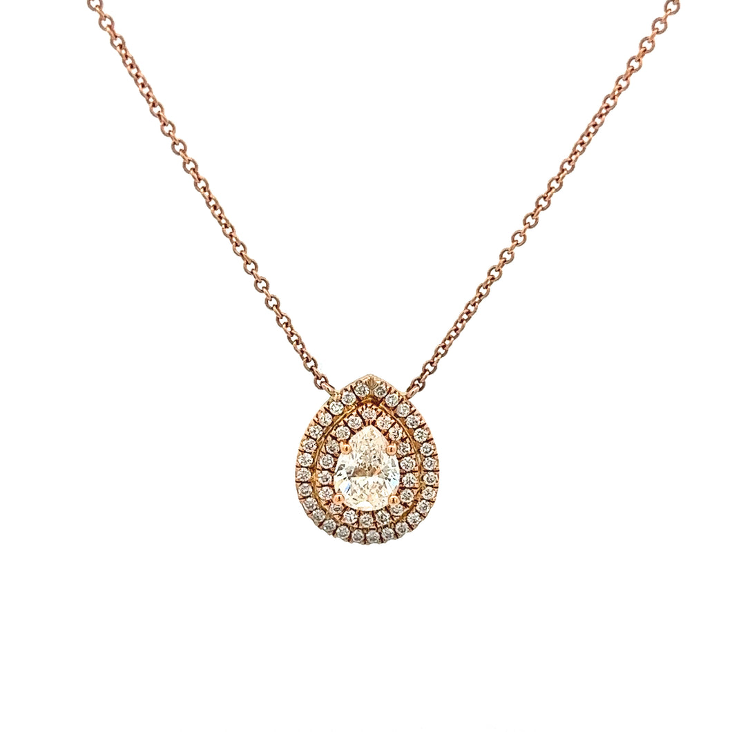This 14k rose gold necklace features a pear shaped center diamond t...
