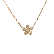 This 14k yellow gold flower pendant features baguette and round bri...