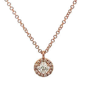 This 14k rose gold necklace features round brilliant cut diamonds i...