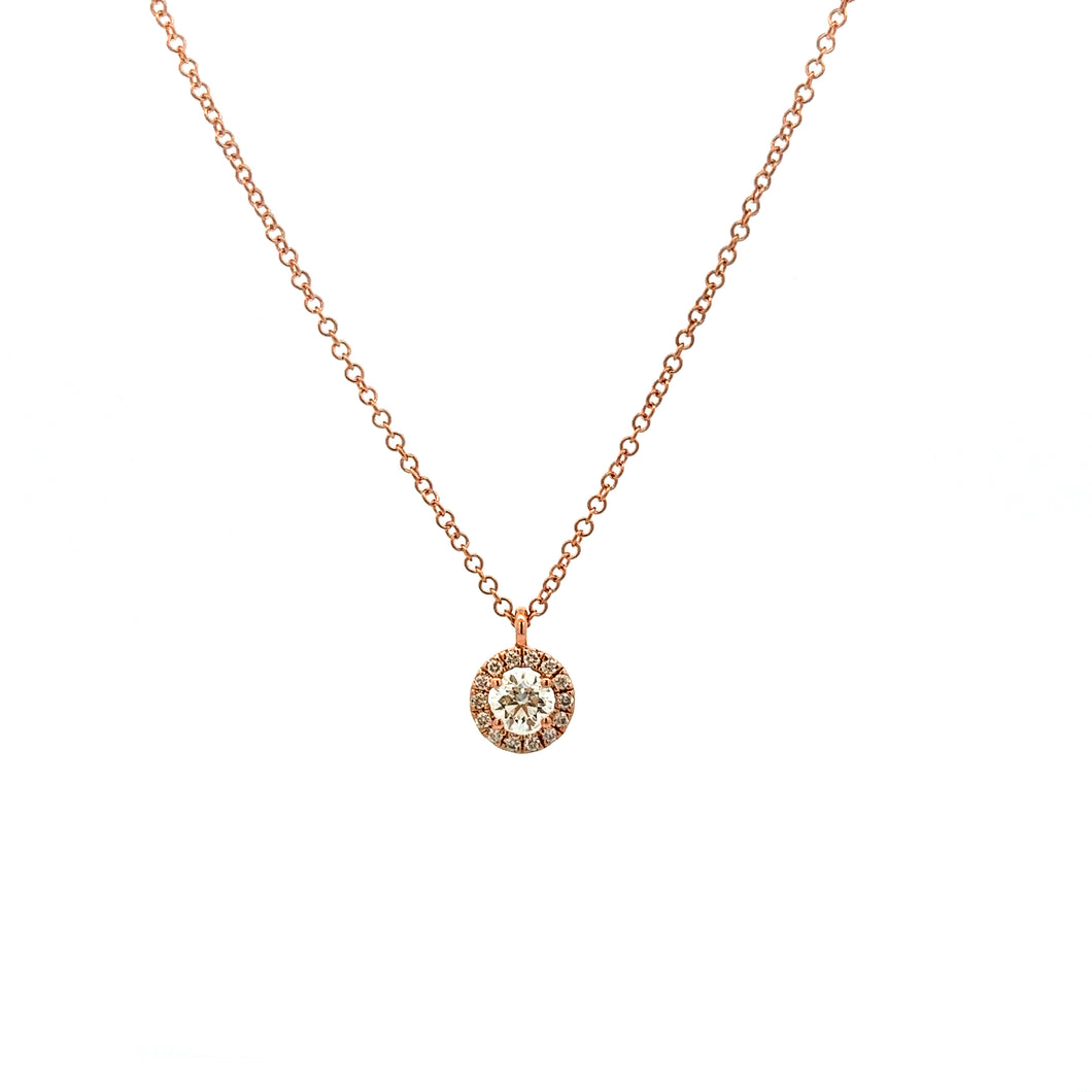 This 14k rose gold necklace features round brilliant cut diamonds i...