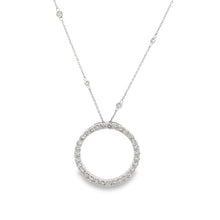 A circle pendant on a 14k white gold chain features 30 round brilli...