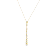 This 14k yellow gold diamond stick pendant features 15 various size...