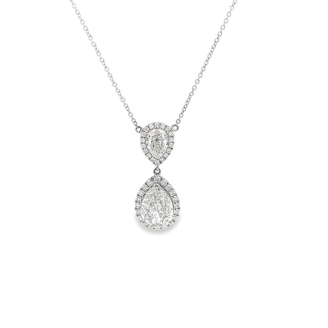 This beautiful 18k white gold pendant features 2 pear shaped diamon...
