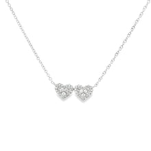 This 14k white gold double heart pendant features pave-set round br...