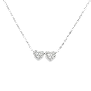 This 14k white gold double heart pendant features pave-set round br...