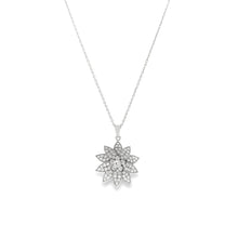 This 18k white gold diamond necklace features a beautiful flower pe...