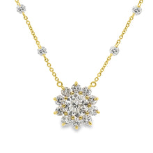 This beautiful 18k yellow gold flower pendant features 1 large roun...
