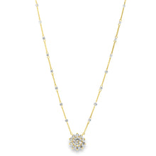 This beautiful 18k yellow gold flower pendant features 1 large roun...