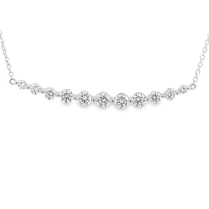 This 14k white gold diamond bar necklace features 11 round brillian...