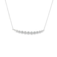 This 14k white gold diamond bar necklace features 11 round brillian...