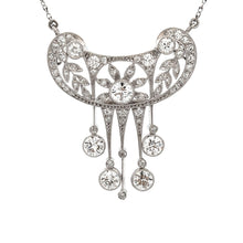 This elegant platinum necklace features round brilliant cut diamond...