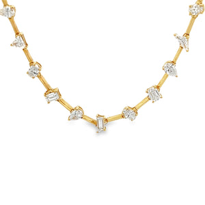 This 18k yellow gold necklace features diamonds of various shapes t...