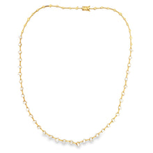 This 18k yellow gold necklace features diamonds of various shapes t...