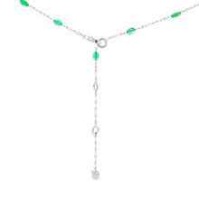 This stunning 18k white gold necklace features diamonds totaling ap...