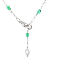 This stunning 18k white gold necklace features diamonds totaling ap...
