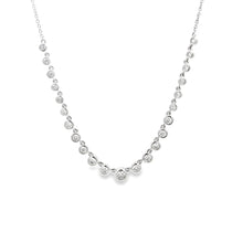 This 14k white gold necklace features 23 round brilliant cut diamon...