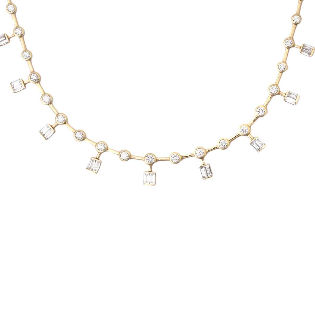 This stunning 18k yellow gold necklace features bezel-set round bri...