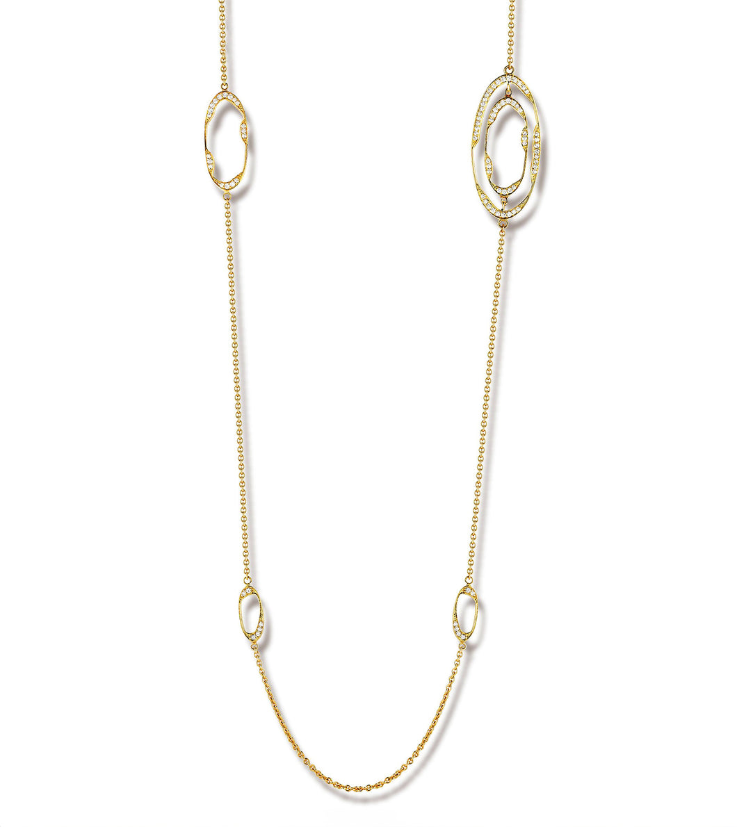 This yellow gold diamond necklace features pave set round brilliant...
