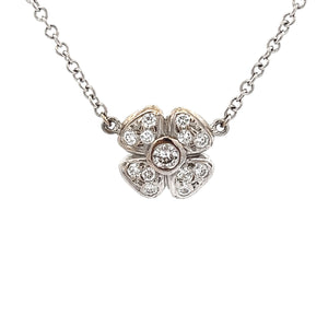 This 14k white gold necklace features 3 flowers with diamonds total...