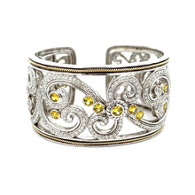 This elegant large bangle features pave-set round brilliant cut dia...