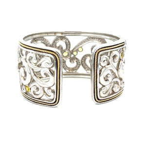 This elegant large bangle features pave-set round brilliant cut dia...