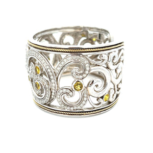This elegant large bangle features pave-set round brilliant cut dia...