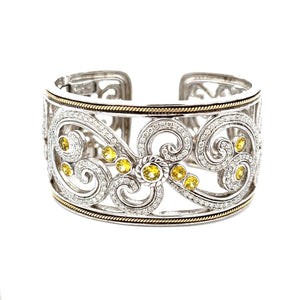 This elegant large bangle features pave-set round brilliant cut dia...