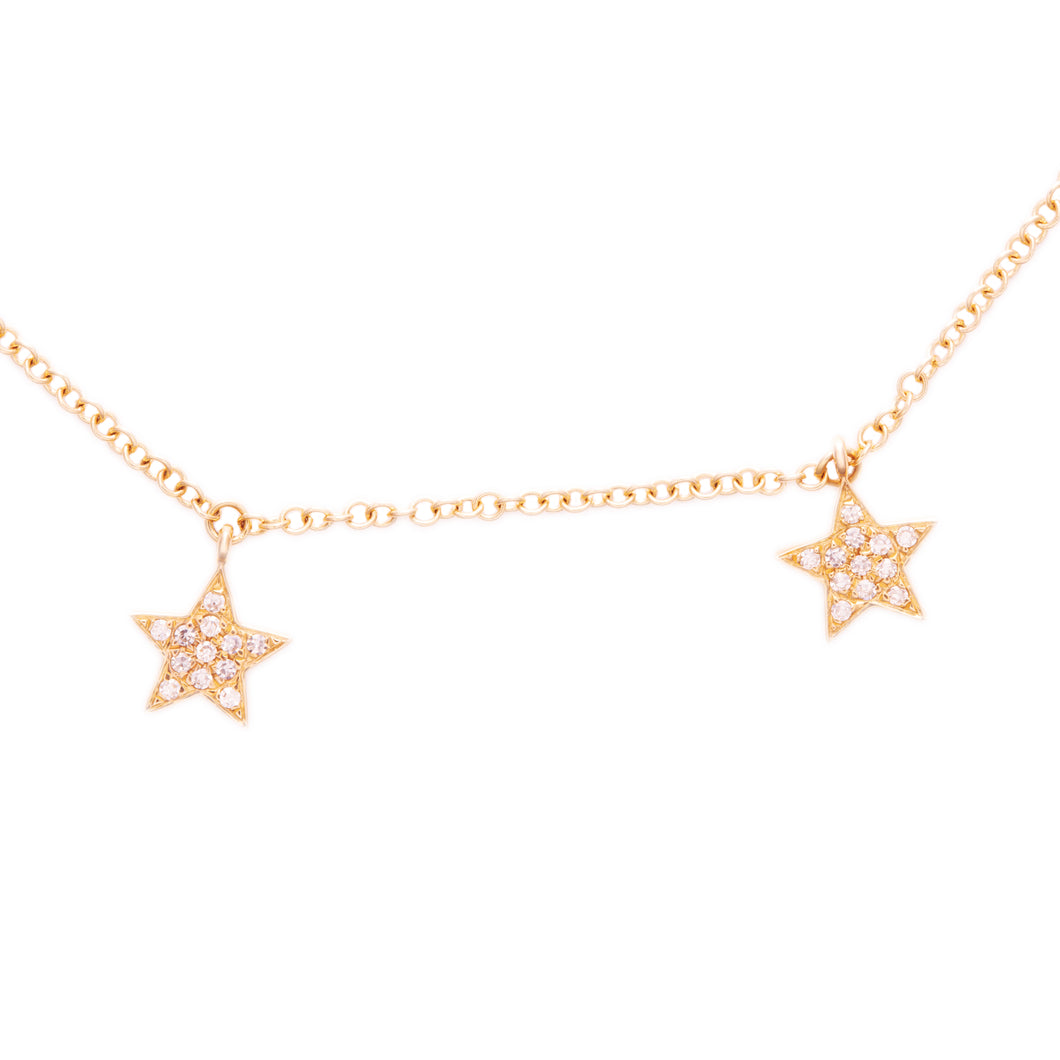 This 14k yellow gold bracelet features 5 dangling stars which are p...