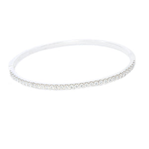 This gorgeous 18k white gold bangle features 36 round brilliant cut...