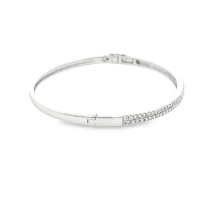 This easy to stack and style bangle features 91 pave-set round bril...