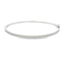 This easy to stack and style bangle features 91 pave-set round bril...
