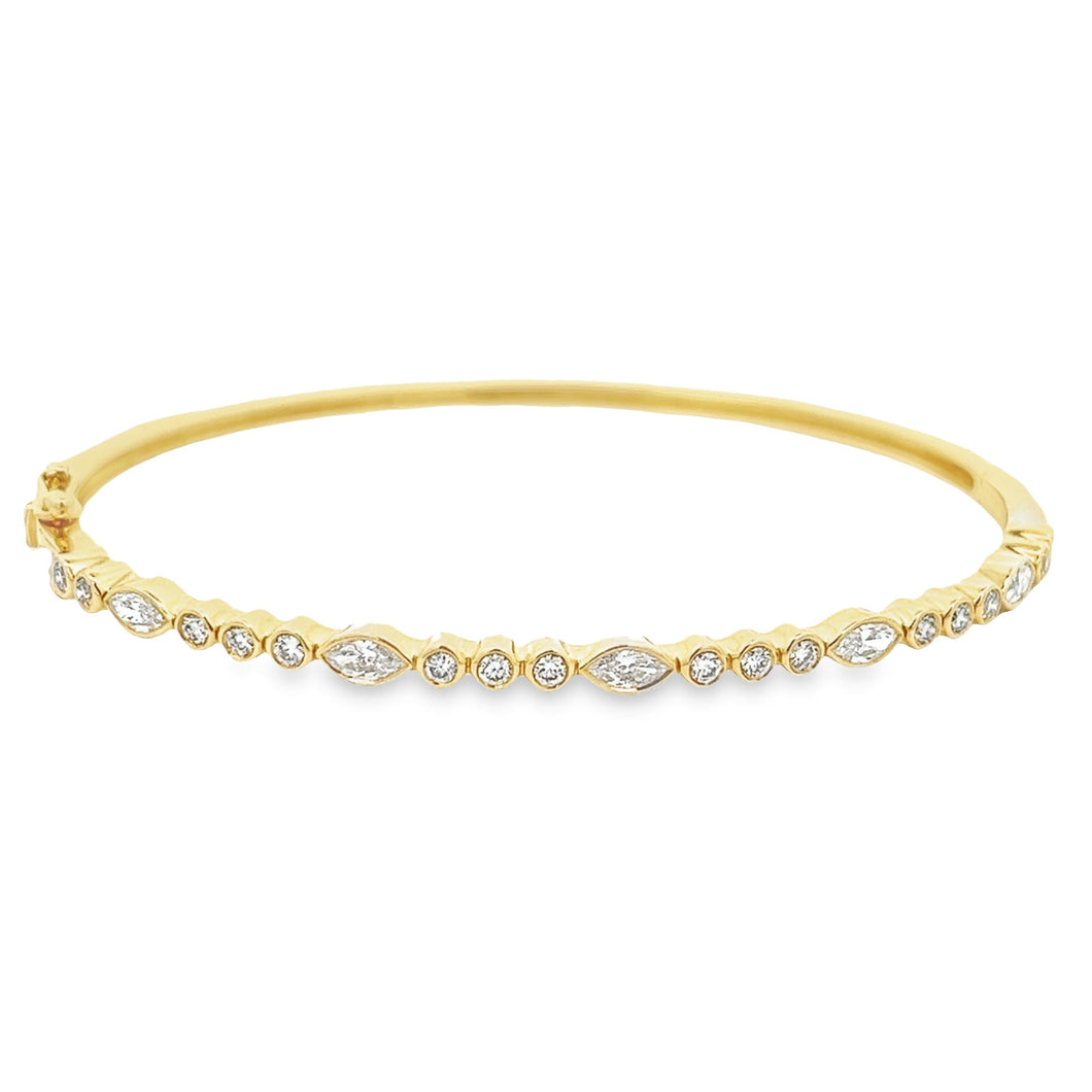 This easy to stack and style 14k yellow gold bangle features round ...