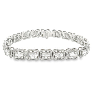 This beautiful 18K white gold diamond bracelet features 90 baguette...