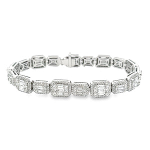 This beautiful 18K white gold diamond bracelet features baguette cu...