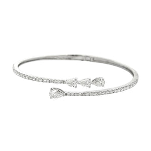 This beautiful 18k white gold diamond bangle features 4 pear shaped...