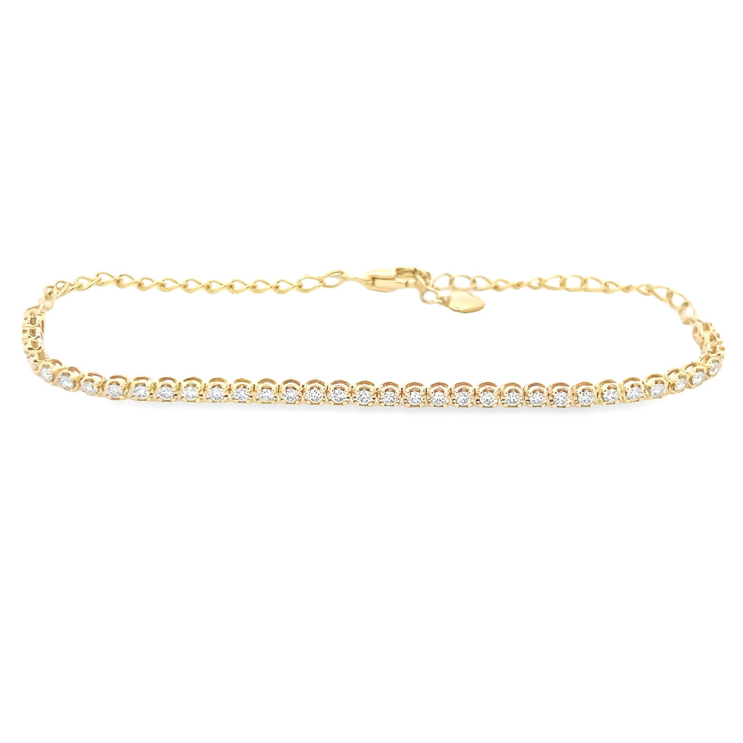This 14k yellow gold diamond bracelet features round brilliant cut ...