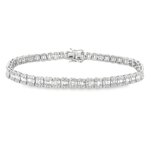 This 14k white gold diamond bracelet features baguette cut diamonds...