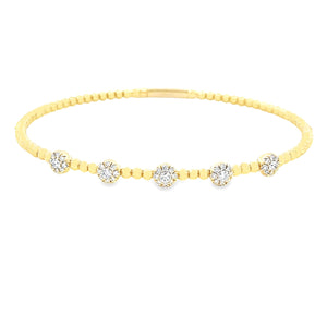 This easy to stack and style 14k yellow gold bangle features round ...