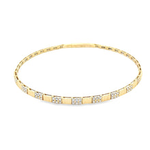 This easy to stack and style 18k yellow gold bangle features 54 rou...