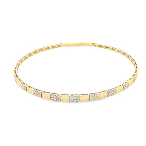 This easy to stack and style 18k yellow gold bangle features 54 rou...