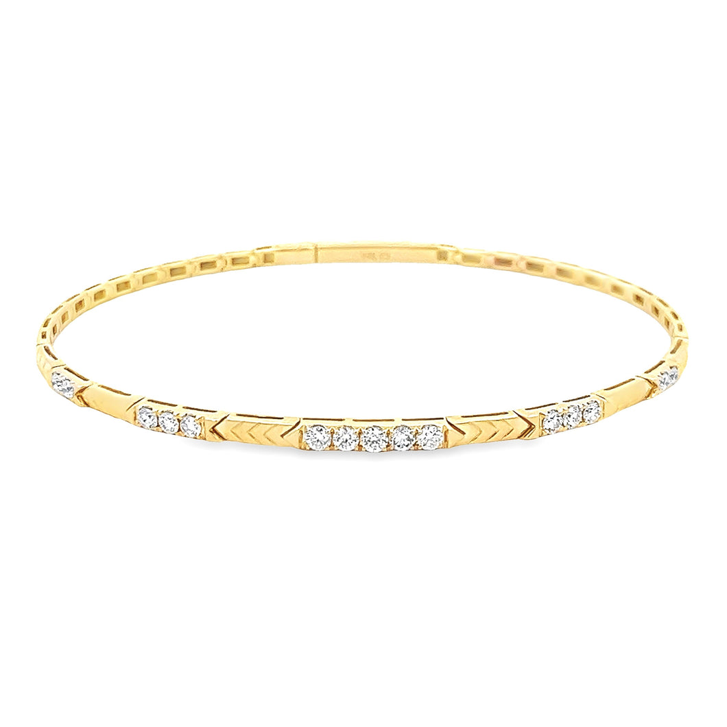 This easy to stack 14k yellow gold bangle features round brilliant ...
