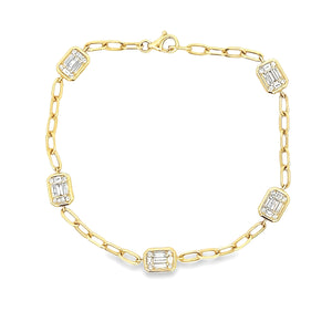 This beautiful 14k yellow gold bracelet features baguette and round...