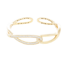 This beautiful 18k yellow gold cuff bangle features round brilliant...